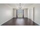 Bedroom with tray ceiling, hardwood floors, and window with natural light at 4044 Elsdon Dr, Austell, GA 30106