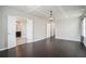 Spacious bedroom with tray ceiling, hardwood floors, and bathroom access at 4044 Elsdon Dr, Austell, GA 30106