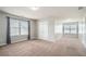 Spacious bedroom with neutral carpet, two windows, and double door closet at 4044 Elsdon Dr, Austell, GA 30106