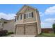 Charming two-story home featuring a two-car garage and neutral siding under a bright blue sky at 4044 Elsdon Dr, Austell, GA 30106