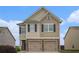 Charming two-story home featuring a two-car garage and neutral siding under a bright blue sky at 4044 Elsdon Dr, Austell, GA 30106