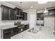 Kitchen with granite countertops, stainless appliances, kitchen island with stylish faucet, and tile backsplash at 4044 Elsdon Dr, Austell, GA 30106