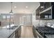 Modern kitchen with stainless appliances, granite countertops, an island, and access to the backyard at 4044 Elsdon Dr, Austell, GA 30106