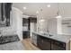 Kitchen features granite countertops, stainless appliances, an island, and mosaic tile backsplash at 4044 Elsdon Dr, Austell, GA 30106