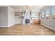 Bright living room features wood floors, fireplace, custom shelving and modern finishes at 4044 Elsdon Dr, Austell, GA 30106