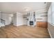 Bright living room features wood floors, fireplace, custom shelving and modern finishes at 4044 Elsdon Dr, Austell, GA 30106