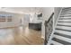 Open-concept living space featuring hardwood floors, natural light, and staircase at 4044 Elsdon Dr, Austell, GA 30106