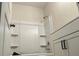Clean bathroom with a white shower-tub combination featuring built-in shelves for storage at 3536 Dogwood Pass, Stonecrest, GA 30038