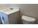 Full bathroom with white toilet and white vanity with white countertop and black modern hardware at 3536 Dogwood Pass, Stonecrest, GA 30038