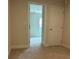 Bedroom boasts neutral walls, plush carpet, and a doorway leading to additional space and a closet at 3536 Dogwood Pass, Stonecrest, GA 30038