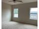 Spacious bedroom with plush carpet and windows offering ample natural light at 3536 Dogwood Pass, Stonecrest, GA 30038