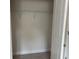 Empty reach in closet with wire shelving and neutral paint; awaiting personal touches at 3536 Dogwood Pass, Stonecrest, GA 30038