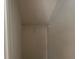 A simple closet with a single rack for hanging clothes, offering practical storage space at 3536 Dogwood Pass, Stonecrest, GA 30038