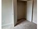 Bedroom closet with bi-fold doors and wire shelving at 3536 Dogwood Pass, Stonecrest, GA 30038