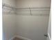 Walk-in closet featuring a full corner of steel shelving for optimal storage at 3536 Dogwood Pass, Stonecrest, GA 30038
