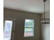 Dining area features a chandelier and a window, offering a pleasant atmosphere at 3536 Dogwood Pass, Stonecrest, GA 30038