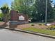 Landscaped entrance sign welcomes residents and visitors to the The Parks at Stonecrest at 3536 Dogwood Pass, Stonecrest, GA 30038