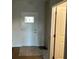 Bright entryway with a large front door and access to other rooms in the home at 3536 Dogwood Pass, Stonecrest, GA 30038
