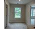 Bright hallway featuring natural light from a window, complemented by neutral walls and carpet at 3536 Dogwood Pass, Stonecrest, GA 30038