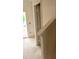 A bright hallway with a view of a doorway, featuring pristine white walls and a glimpse of the unfinished flooring at 3536 Dogwood Pass, Stonecrest, GA 30038