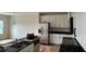 Kitchen with modern stainless steel appliances, white cabinets and dark countertops at 3536 Dogwood Pass, Stonecrest, GA 30038