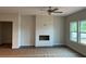 Bright living room with a sleek fireplace and multiple windows at 3536 Dogwood Pass, Stonecrest, GA 30038