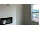 Living room featuring a fireplace and window for natural light at 3536 Dogwood Pass, Stonecrest, GA 30038