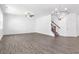 Spacious living room with modern chandelier, vinyl floors, and staircase to the second floor at 3536 Dogwood Pass, Stonecrest, GA 30038