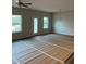 Spacious living room with ample natural light from windows, ready for flooring at 3536 Dogwood Pass, Stonecrest, GA 30038
