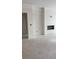 Bright living room area with a modern fireplace, ready to be customized at 3536 Dogwood Pass, Stonecrest, GA 30038