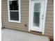 Back patio with new window and glass door at 3536 Dogwood Pass, Stonecrest, GA 30038