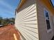 Home's rear elevation features several windows for natural light and a door for easy backyard access at 3536 Dogwood Pass, Stonecrest, GA 30038