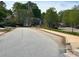 A quiet neighborhood street lined with trees and well-maintained homes offers a serene living environment at 3536 Dogwood Pass, Stonecrest, GA 30038