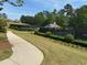 Landscaped tennis courts and clubhouse showcase the community's recreational amenities at 3536 Dogwood Pass, Stonecrest, GA 30038