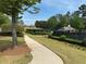The community provides tennis courts surrounded by a lush lawn and landscaping at 3536 Dogwood Pass, Stonecrest, GA 30038