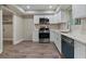 Modern kitchen features stainless steel appliances, white cabinets and beautiful flooring at 111 Fair Haven Se Way, Smyrna, GA 30080