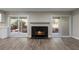 Bright living room with a tiled fireplace and sliding glass doors leading to a patio at 111 Fair Haven Se Way, Smyrna, GA 30080
