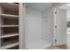 Walk-in shower featuring built-in storage space at 111 Fair Haven Se Way, Smyrna, GA 30080