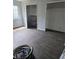 This image captures a spare bedroom featuring empty closets and minimal furnishings at 1316 Camelot Dr, College Park, GA 30349