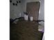 Features a cluttered bedroom interior with hardwood flooring and scattered debris at 1316 Camelot Dr, College Park, GA 30349