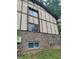 Exterior brick facade with unfinished window repairs at 1316 Camelot Dr, College Park, GA 30349