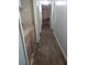 Hallway featuring wood floors, gray walls, and bright overhead lighting at 1316 Camelot Dr, College Park, GA 30349