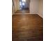 Spacious living room featuring wood floors and a decorative mirror at 1316 Camelot Dr, College Park, GA 30349