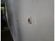 Highlights wall damage, including holes and a broken switch plate, needing repair at 1316 Camelot Dr, College Park, GA 30349