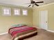 Bedroom featuring carpeted floors, windows, ceiling fan and neutral paint at 220 Fannin Ln, Mcdonough, GA 30252