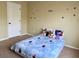 Bedroom with a bed and colorful sports themed wall decorations at 220 Fannin Ln, Mcdonough, GA 30252