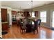 Well-equipped kitchen with stainless steel appliances, a central island, and a dining area at 220 Fannin Ln, Mcdonough, GA 30252