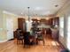 Bright kitchen with stainless appliances, hardwood floors, and a breakfast nook near the windows at 220 Fannin Ln, Mcdonough, GA 30252
