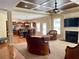 Open concept living area with fireplace, kitchen view, and cozy seating arrangement at 220 Fannin Ln, Mcdonough, GA 30252