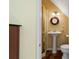 Bright bathroom features a pedestal sink, decorative mirror, and a glass door shower at 4820 Coppedge Trl, Peachtree Corners, GA 30096
